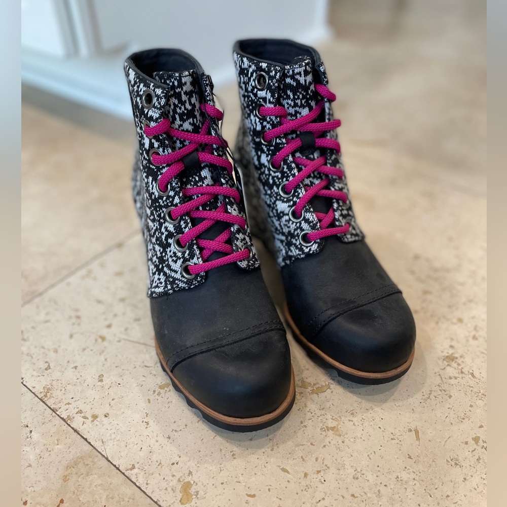 Black with white Sorels. Never been worn. Great for winter and fall.
